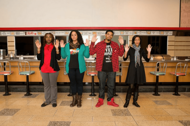 Four new digital citizens stand in front of the lunch counter at the ICRC&M 55 years after four A&T students launched the 1906s sit in movement. Left to right: Alexis Anderson, April Parker, Irving Allen, and Kristen Jeffers. Photo by Stephen Charles.